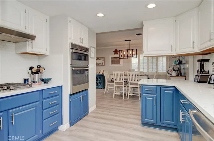 Remodeled kitchen with two toned cabinets, quartz countertops, and upgraded appliances.
