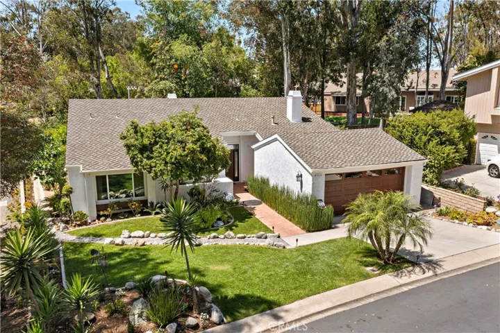 A picture perfect CDS!  Snugged into the heart of the woods is a single level home with charm, interesting lines and open spaces  and loads of square footage on a single level.  4 BR, 2 BA and approximately 2214 sq. ft.