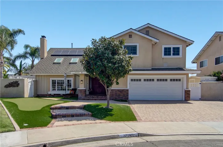 Excellent cul-de-sac location with beautiful paver driveway, EZ care turf and your own putting green!