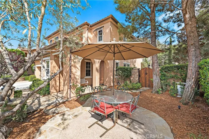 Front patio area surrounded by mature trees