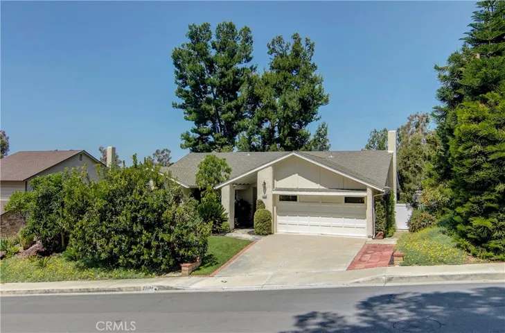 This setting can't be beat!  Quiet, single loaded street and gorgeous plantings create your own private woodland retreat!