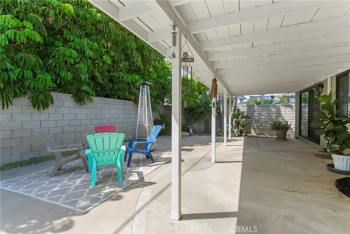Huge covered patio space is a room unto itself...we're thinking...outdoor pool table, ping pong, darts, flat screen, bar...you get the idea(s)!