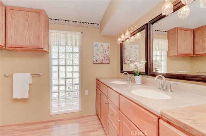 Owner's bath has lots of counter and storage space...even room for soaking tub or giant shower.
