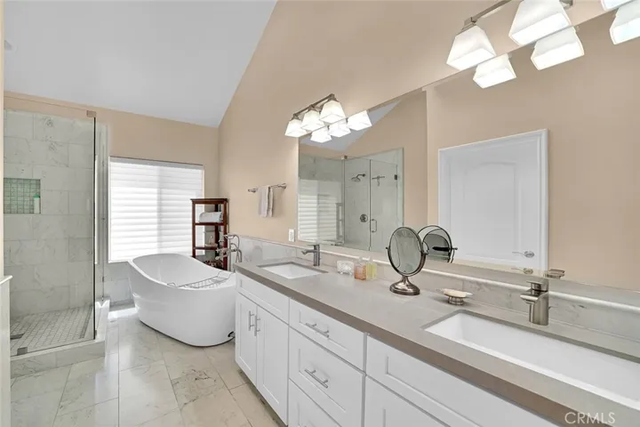 Marble floors, new vanity and soaking tub.
