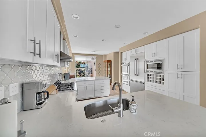 Upgraded kitchen with quartz counters.
