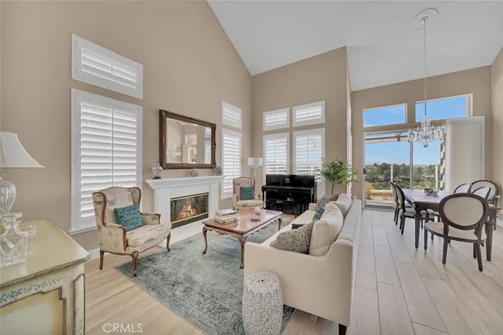 Gorgeous, inviting entry and living room with high ceilings.