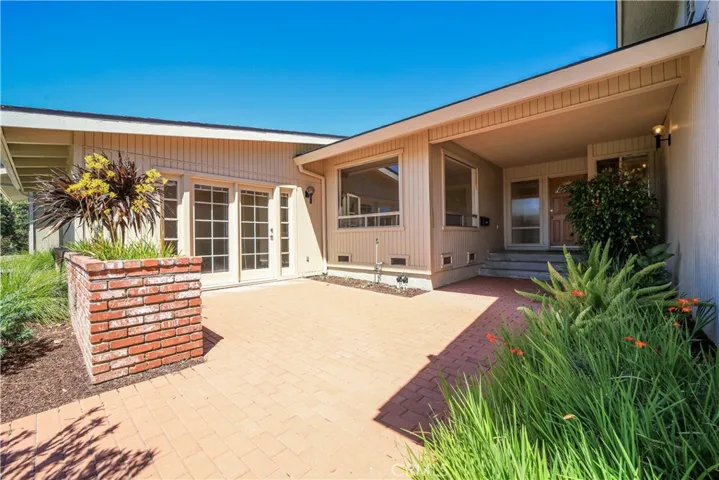 Courtyard with French doors accessing the guest suite.