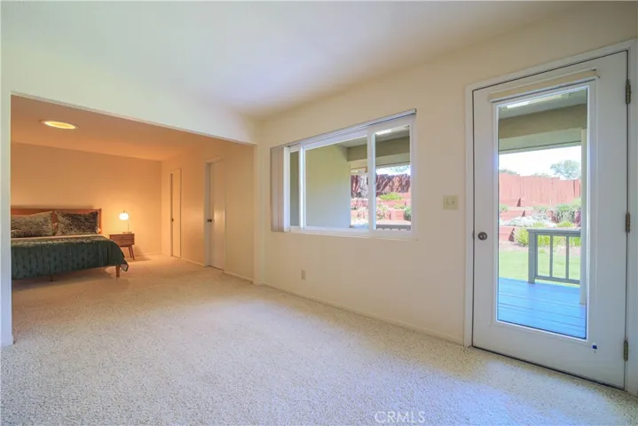 Bonus room/sitting area overlooks the deck.