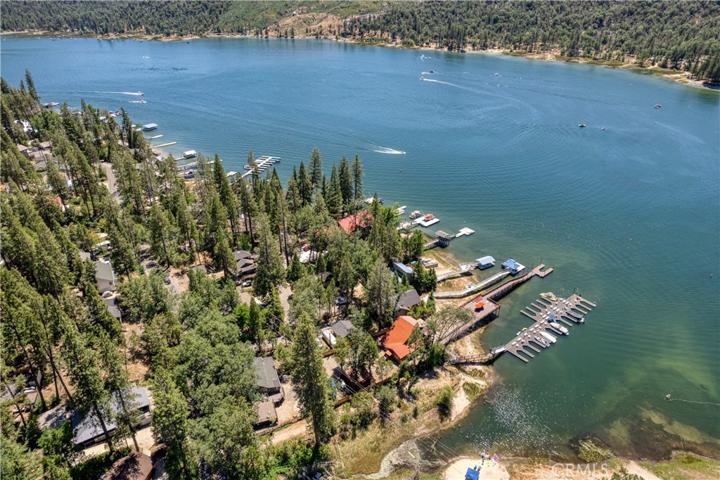 Aerial view of the subject property (the Red House) with the Long private dock.Depicted is not a full lake.