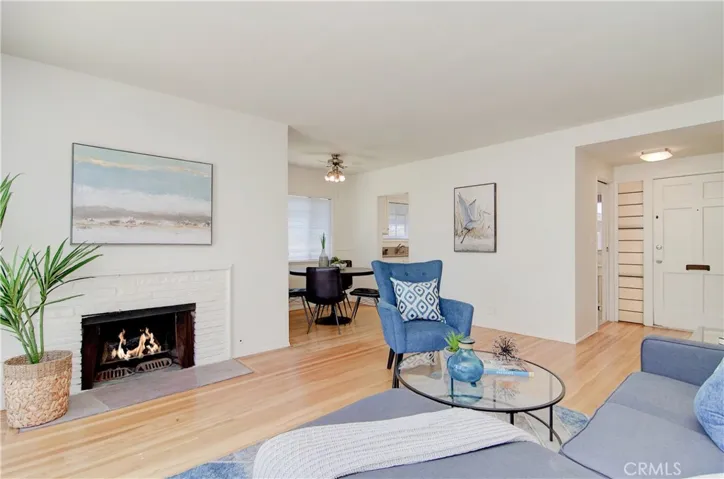 Cozy fireplace and refinished "original" hardwood floors add so much warmth and appeal.