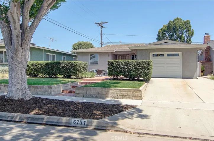 Excellent street appeal with newer stucco, refreshed landscape and privacy hedge.
