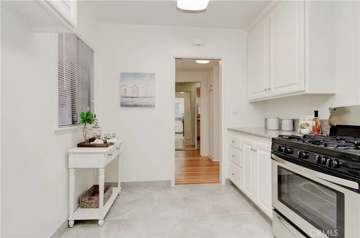 Bright white cabinetry, granite counters and stainless accents...any chef will love this space.