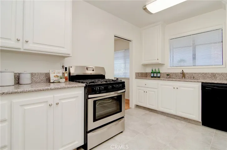 Garden window at the sink, contemporary flooring and brand new appliances...YES!