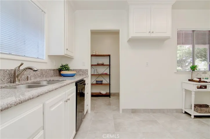Plenty of prep and storage space in this bright kitchen...and every cook loves a window at the sink!