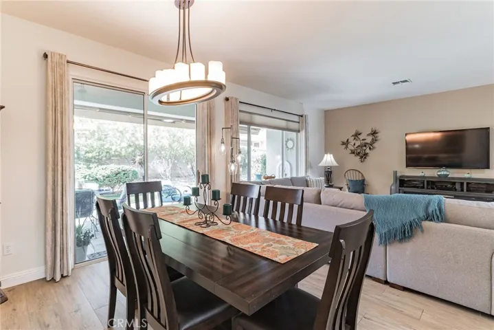 SLIDING GLASS DOORS TO PATIO IN DINING ROOM