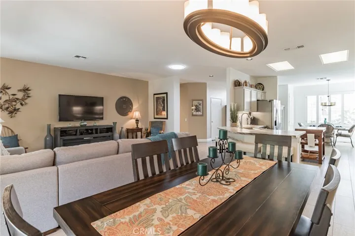 GREAT ROOM--DINING ROOM OPENS TO LIVING ROOM & KITCHEN