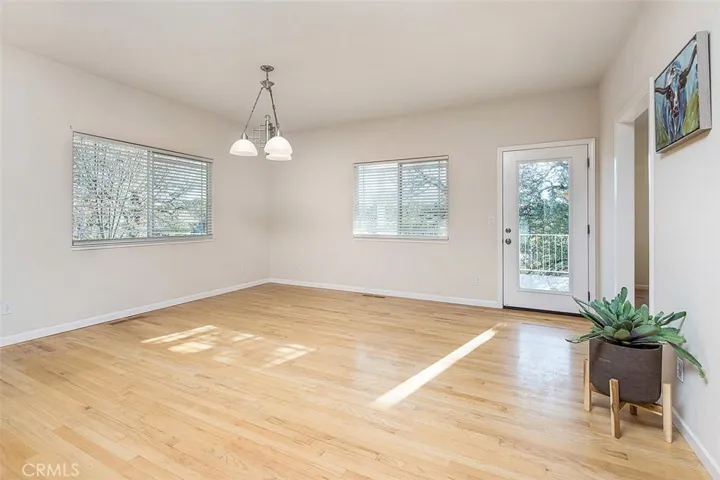 Dining area with beautiful wood flooring.