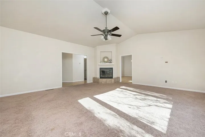 The expansive living room has a gas fireplace.