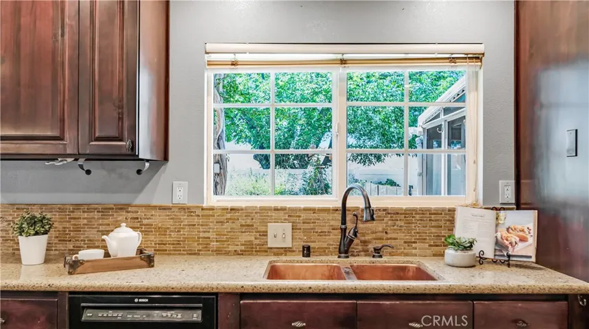 Look out to the beautiful garden in the backyard. Quiet Bosch dishwasher included.