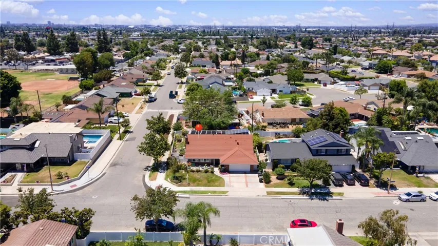 This stunning home has a newly insulated garage door, gutters, metal roof, 2-car garage, 3-car driveway, and pull down stairs to a garage storage attic