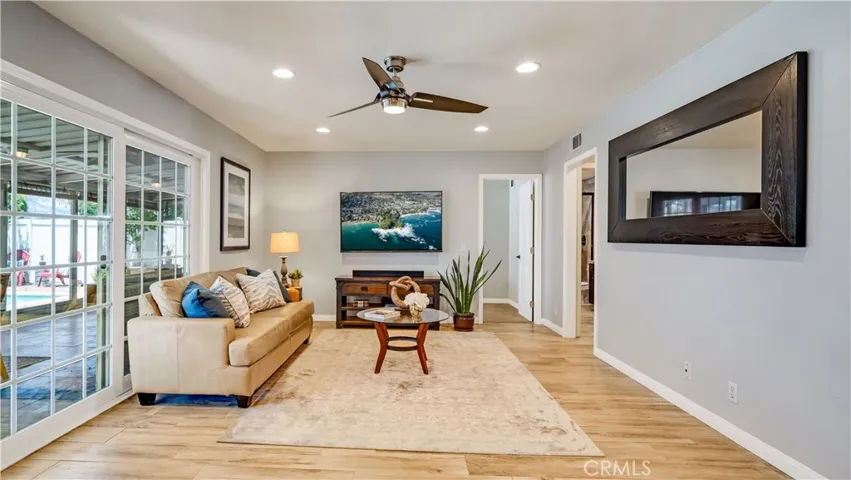 Currently used as a family/TV room, it could also be a dining room
