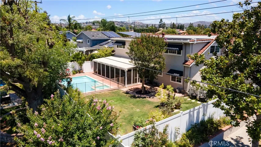 Incredibly unique and flat outdoor garden areas including a gated garden with more raised beds to the right
