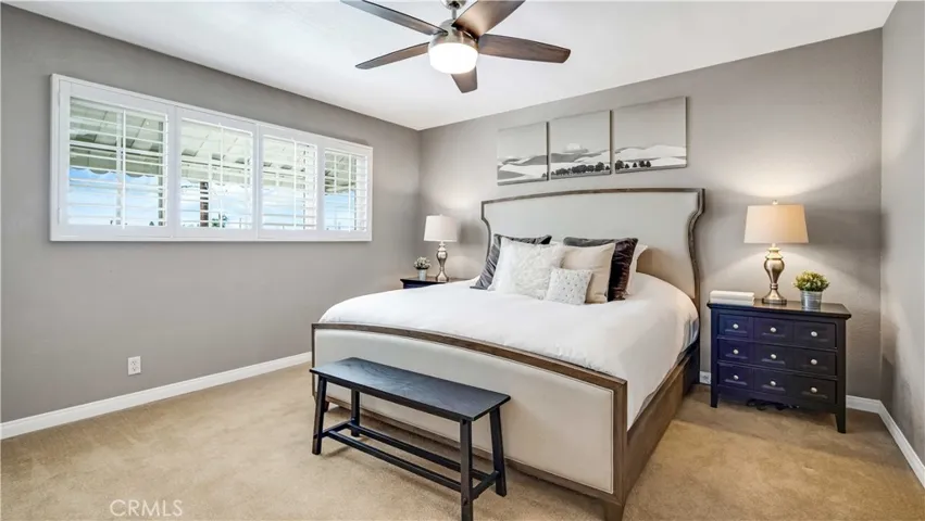 Primary bedroom is spacious with views of the Disneyland fireworks in the far distance