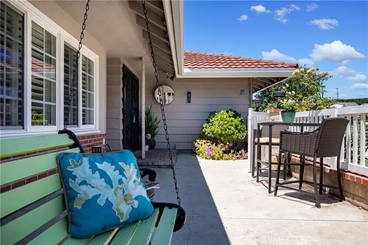 The front porch is a very usable outdoor space for enjoying cocktails in the evening