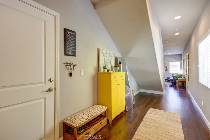 Hallway to living area, bathroom, and garage