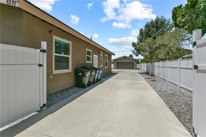 Gated entrance to detached garage.