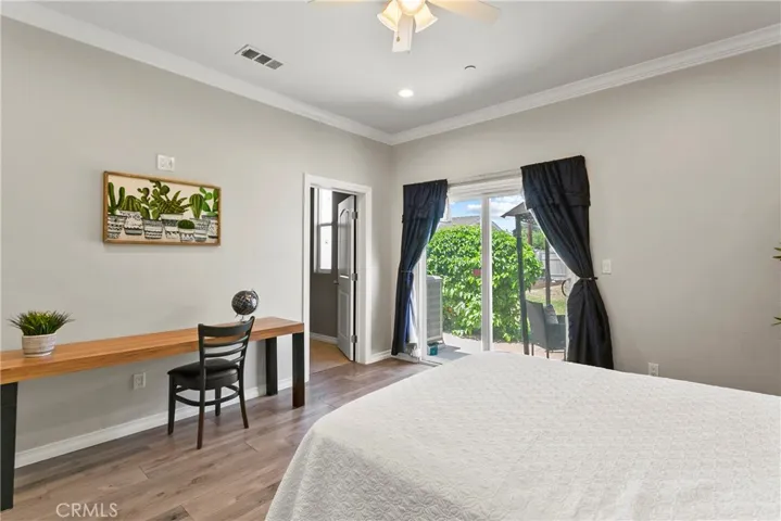 Master bedroom opens to giant backyard.
