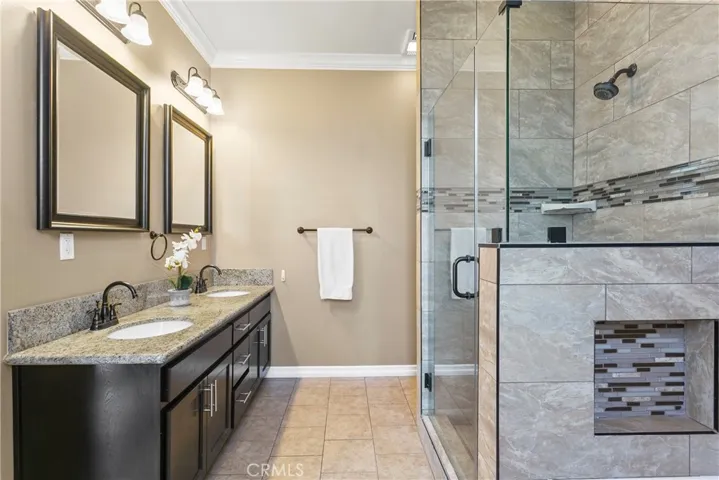 Master bath also has dual sinks and a separate shower.