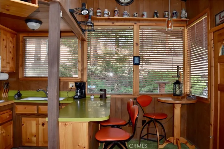 Light and bright kitchen with new knotty pine facings and a breakfast bar!