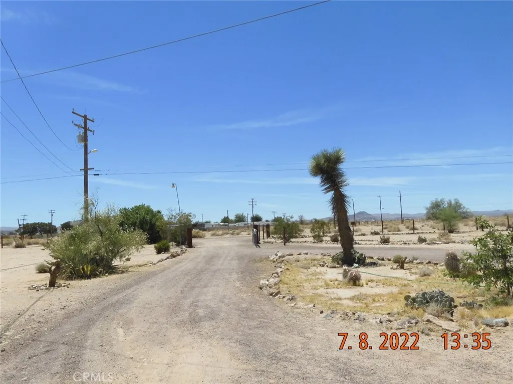 From the property, looking down the driveway.  Go through the gate, turn left and go out to Calico Blvd.