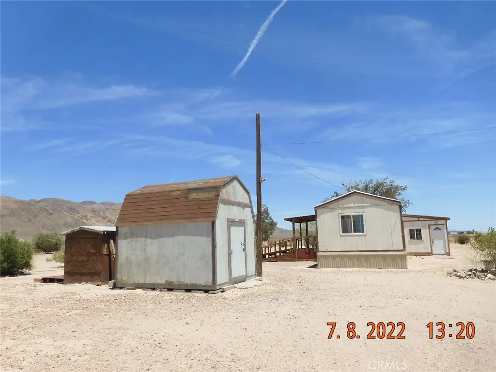 Storage shed and mobile home.