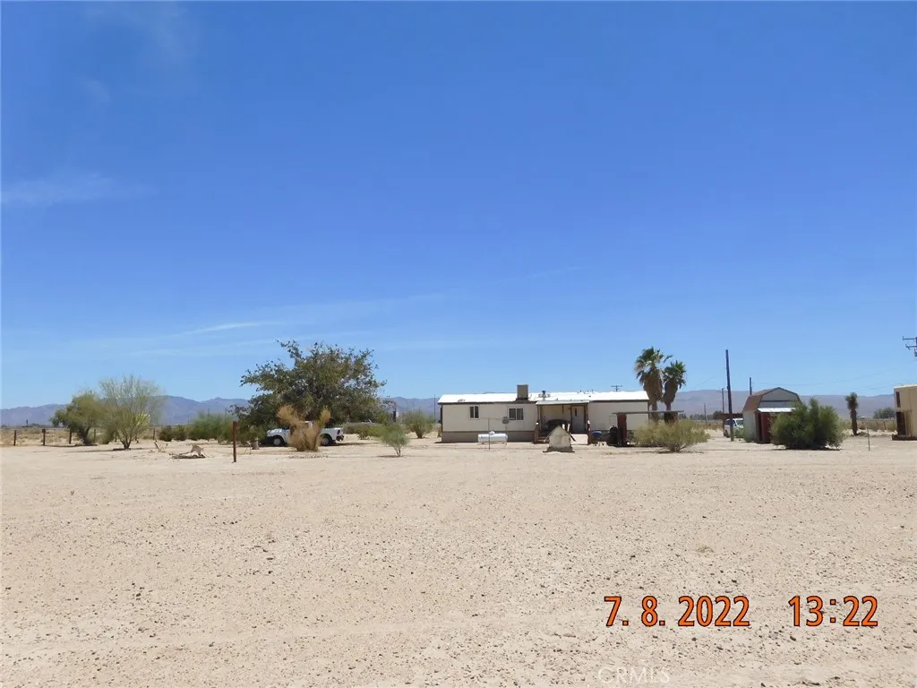 Looking south, from the very back of the parcel, at the back of the home.