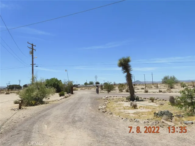 From the property, looking down the driveway.  Go through the gate, turn left and go out to Calico Blvd.