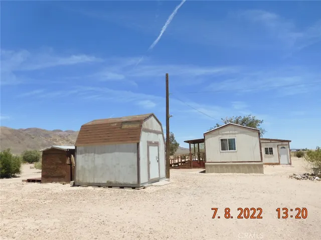 Storage shed and mobile home.