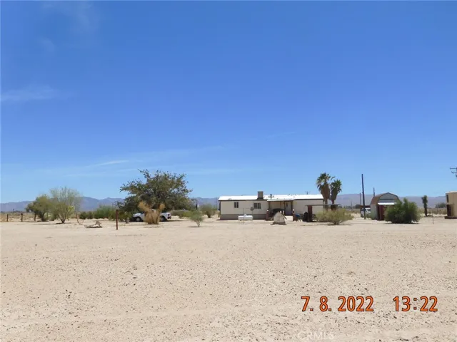 Looking south, from the very back of the parcel, at the back of the home.