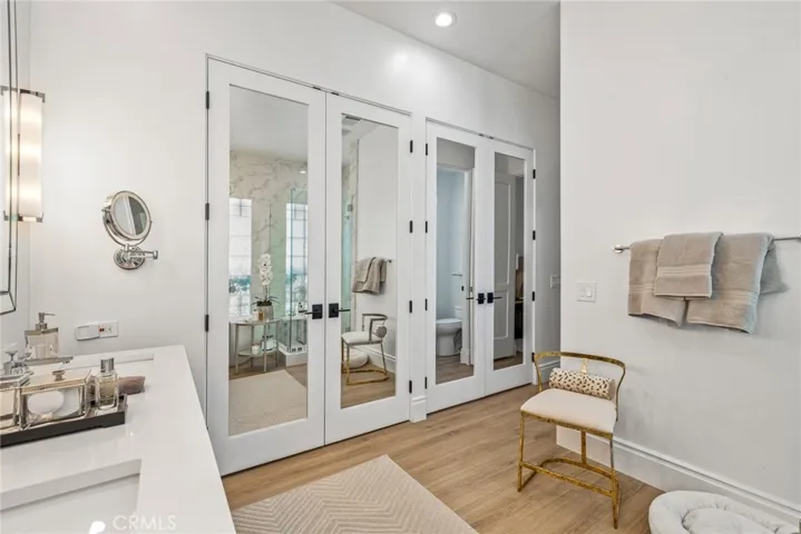 Master bathroom with walk in closets