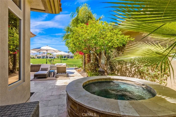 Built in spa privately located in the yard.