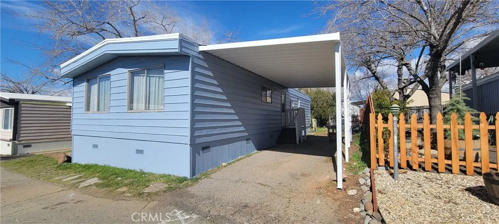 Front of Unit# B-13 n B-11 Homes shot. New Exterior Paint and Carport. Located at the Foothill Mobile Park close to Butte College with very scenic views, safety and privacy. Only 15 minutes from Chico and Oroville. Just REMODELLED.