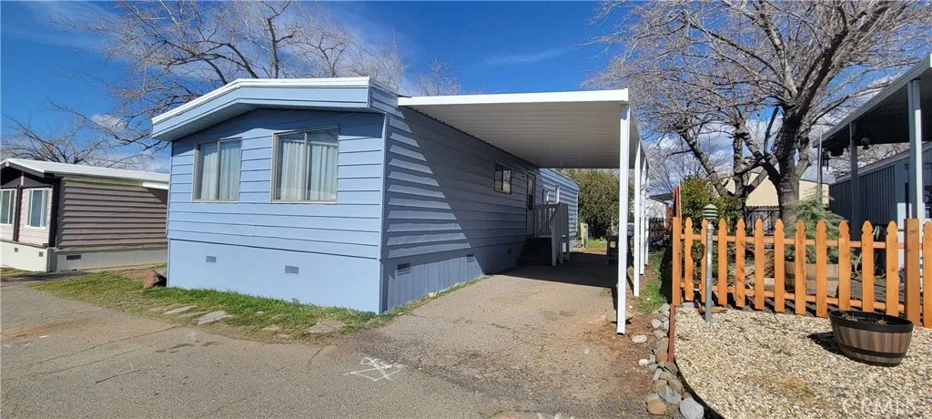 Front of Unit# B-13 n B-11 Homes shot. New Exterior Paint and Carport. Located at the Foothill Mobile Park close to Butte College with very scenic views, safety and privacy. Only 15 minutes from Chico and Oroville. Just REMODELLED.
