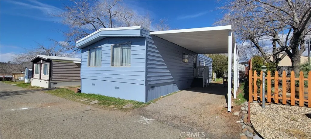 Front of Unit# B-13 n B-11 Homes shot. New Exterior Paint and Carport. Located at the Foothill Mobile Park close to Butte College with very scenic views, safety and privacy. Only 15 minutes from Chico and Oroville. Just REMODELLED.