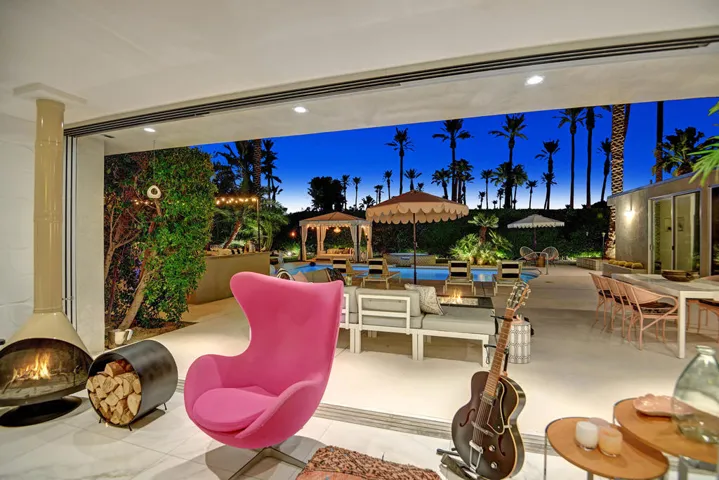 LIVING ROOM OUT TO POOL YARD NIGHT MLS