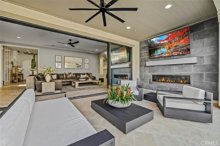 California room with fireplace, ceiling fan and Tv