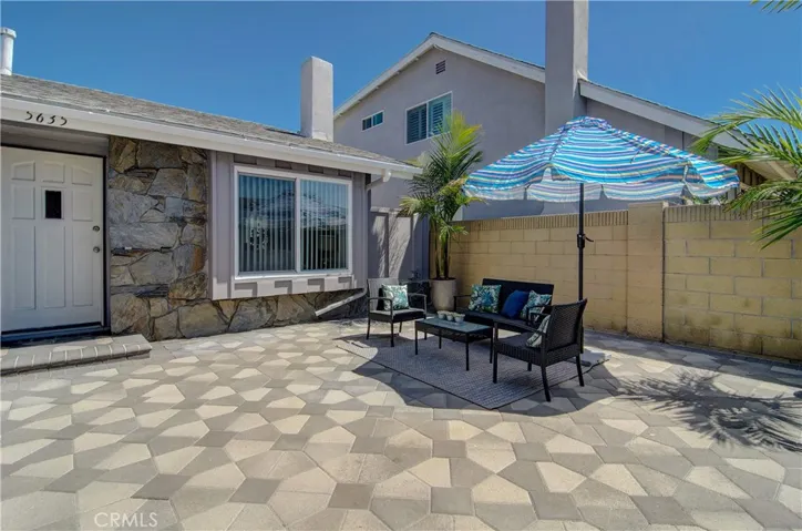 Lovely, enclosed entry courtyard extends your living space outdoors...love the pavers here too!