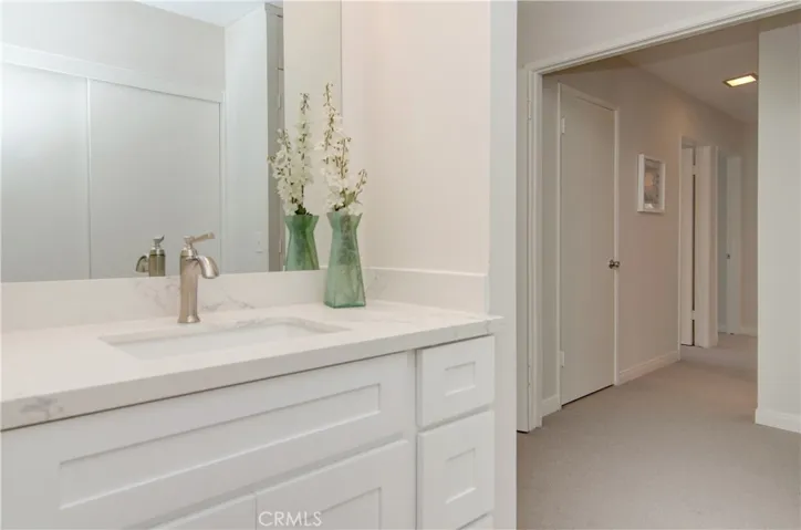 Dressing area has brand new vanity with quartz counter.
