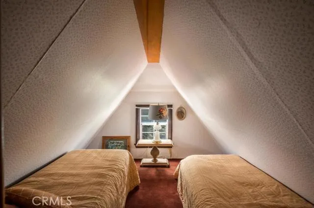 KIDS SLEEP ROOM IN DORMER OVERLOOKING BACKYARD FOREST.