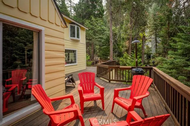 MASSIVE WRAP AROUND DECKING OVERLOOKING THE BACKYARD FOREST COMPLETE WITH GAS HOOK UP BBQ AREA.